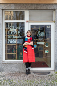 Germany, Saxony-Anhalt, Magdeburg, Sarah Werner, owner of the packaging-free grocery store "Frau Erna`s loser Lebenspunkt", stands at the entrance of her unpackaged shop. Germany, Saxony-Anhalt, Magdeburg, Sarah Werner, owner of the packaging-free grocery store "Frau Erna`s loser Lebenspunkt", stands at the entrance of her unpackaged shop.
